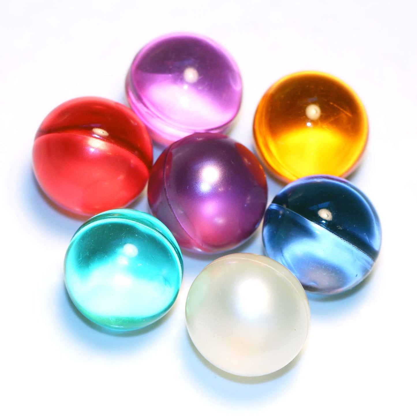 SKLEERskincare vintage style mixed color bath beads displayed on a bathroom counter.