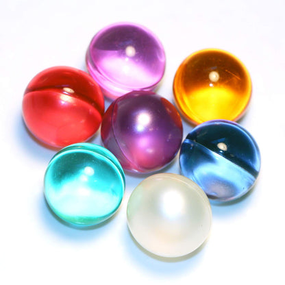 SKLEERskincare vintage style mixed color bath beads displayed on a bathroom counter.