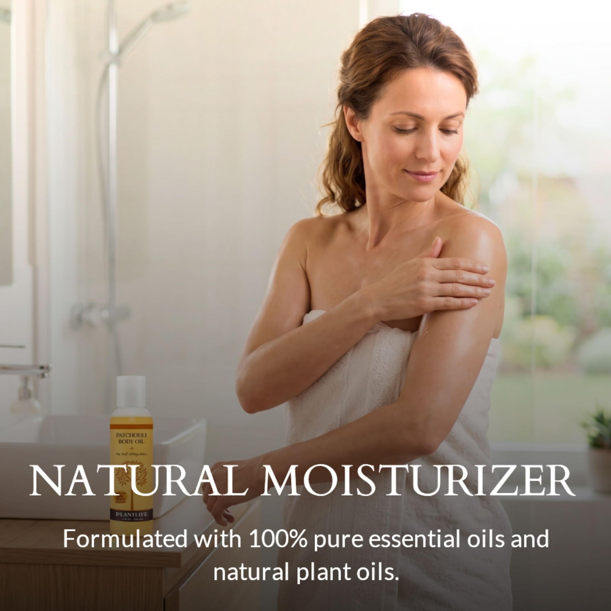 Plantlife Patchouli Bath and Massage Oil yellow liquid formula showing the ingredients label