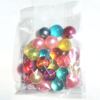 A collection of colorful round bath oil beads showcasing the different shades available.