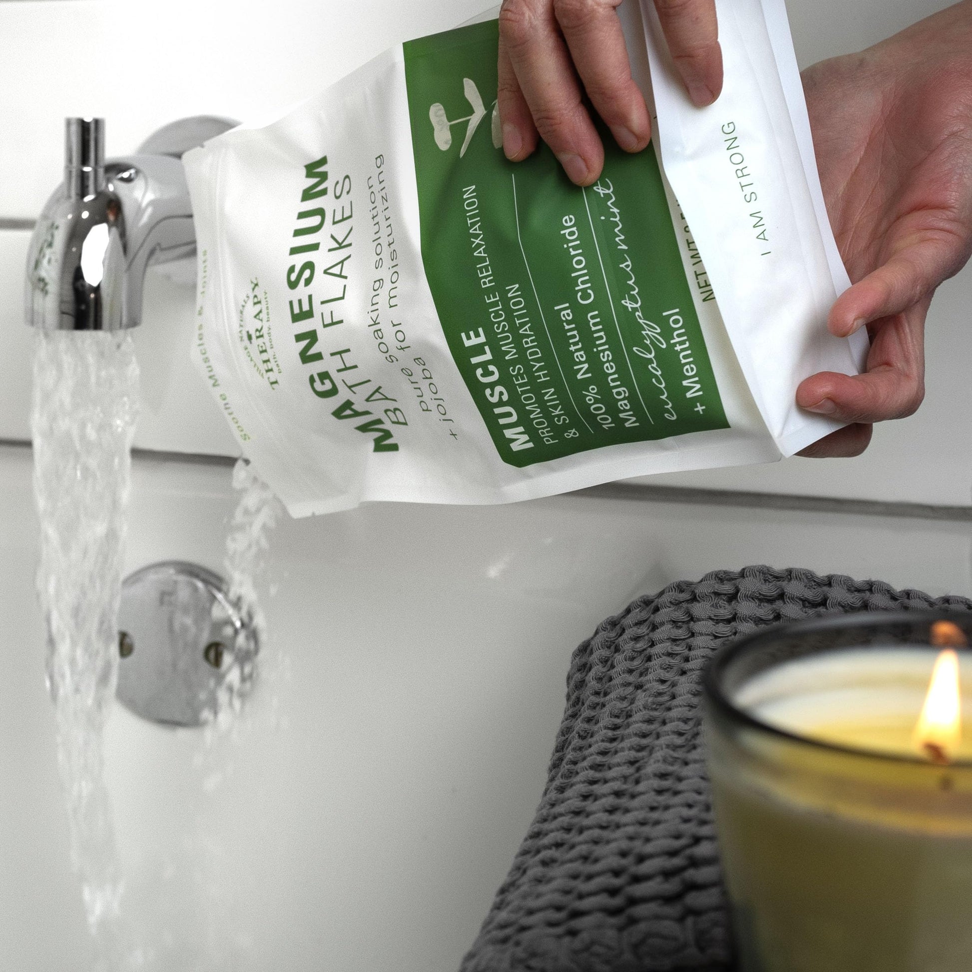 Village Naturals Therapy bath soak lifestyle shot in a bathtub