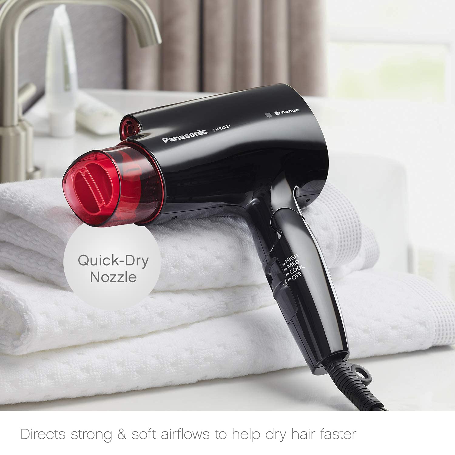 Panasonic nanoe travel hair dryer being held to demonstrate lightweight size
