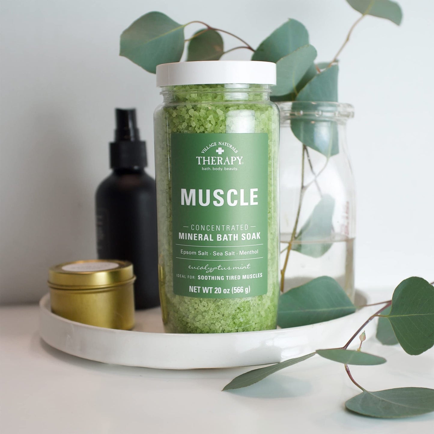 Side profile of Village Naturals Therapy 20 Ounce mineral soak container