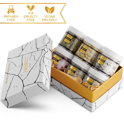 Six piece luxury self-care collection unboxed showcasing the variety of natural herbal scents for body care.