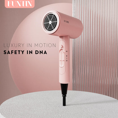 Funtin baby pink hair dryer showing the interactive heat control buttons and cool shot switch