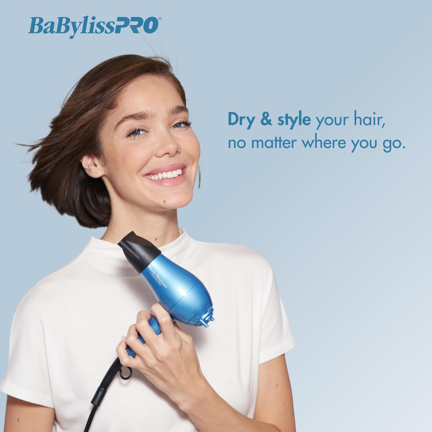 BaBylissPRO travel dryer with the included professional styling concentrator nozzle attached securely to the barrel.