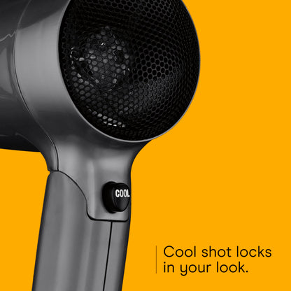 Conair dual voltage dryer showing the cool shot button position below the barrel