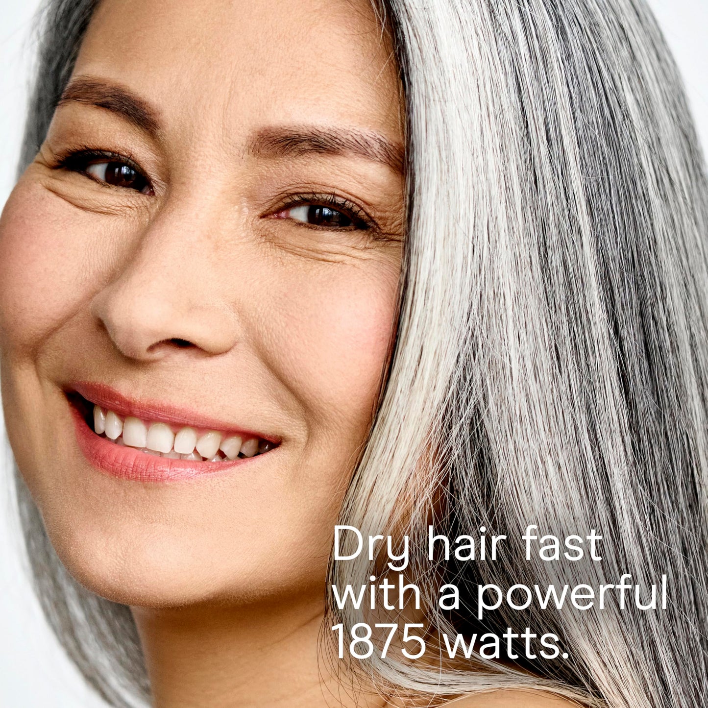 Conair 1875 Watt travel hair dryer being held to demonstrate the lightweight ergonomics