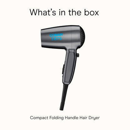Unfolded Conair travel blow dryer next to its power cord on a neutral backdrop