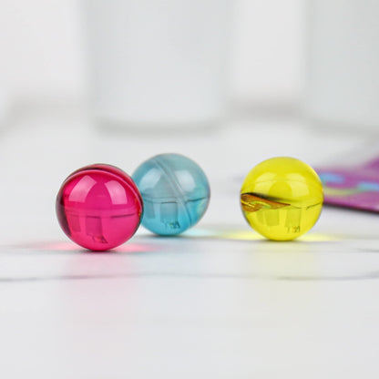 Close up of Gift Republic Liquid Spirit multicolored tropical scented bath pearls