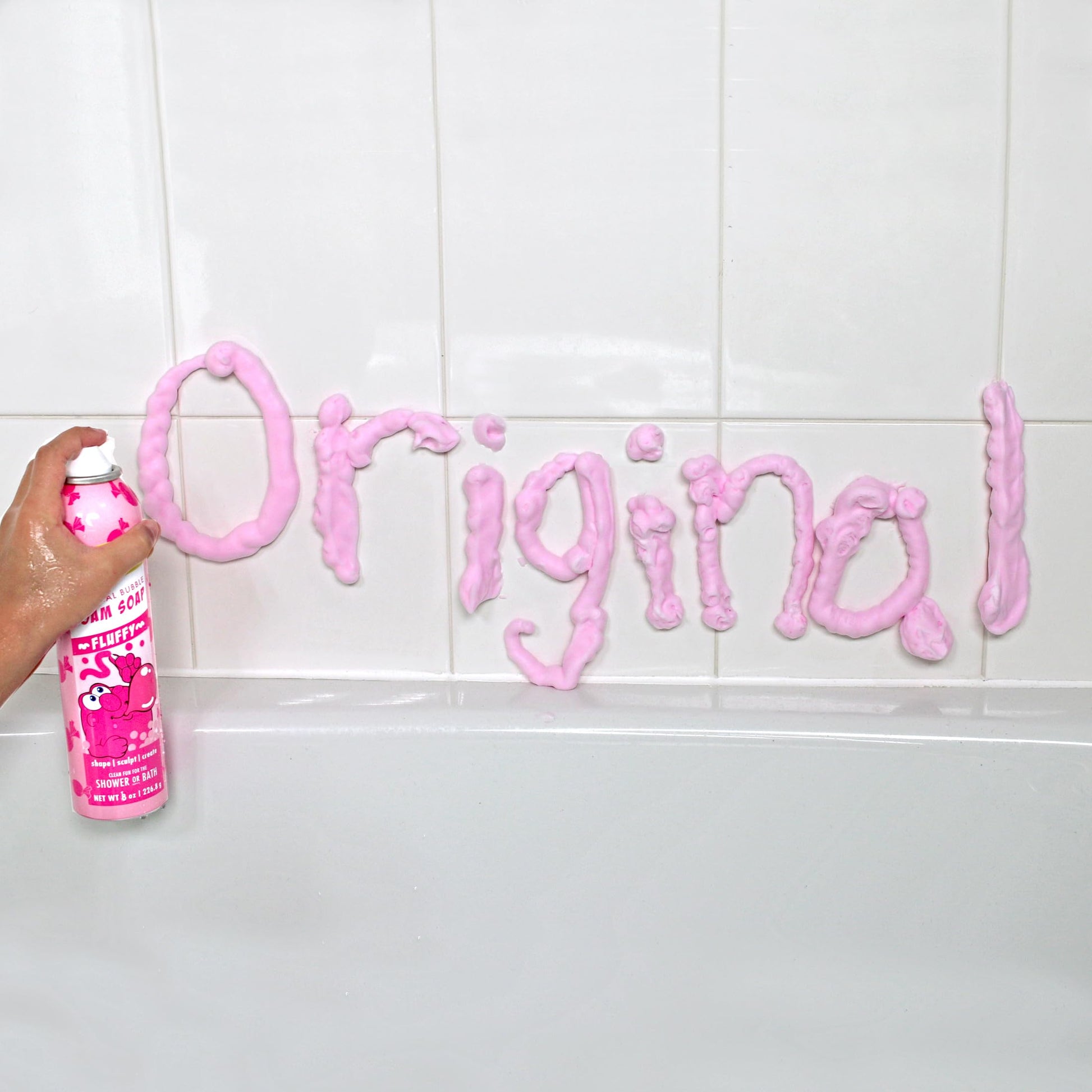 Child using Mr. Bubble foam soap to sculpt shapes in the bathtub