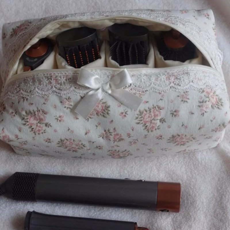 Interior pockets of the Cohawk hair dryer bag filled with styling attachments and clips.