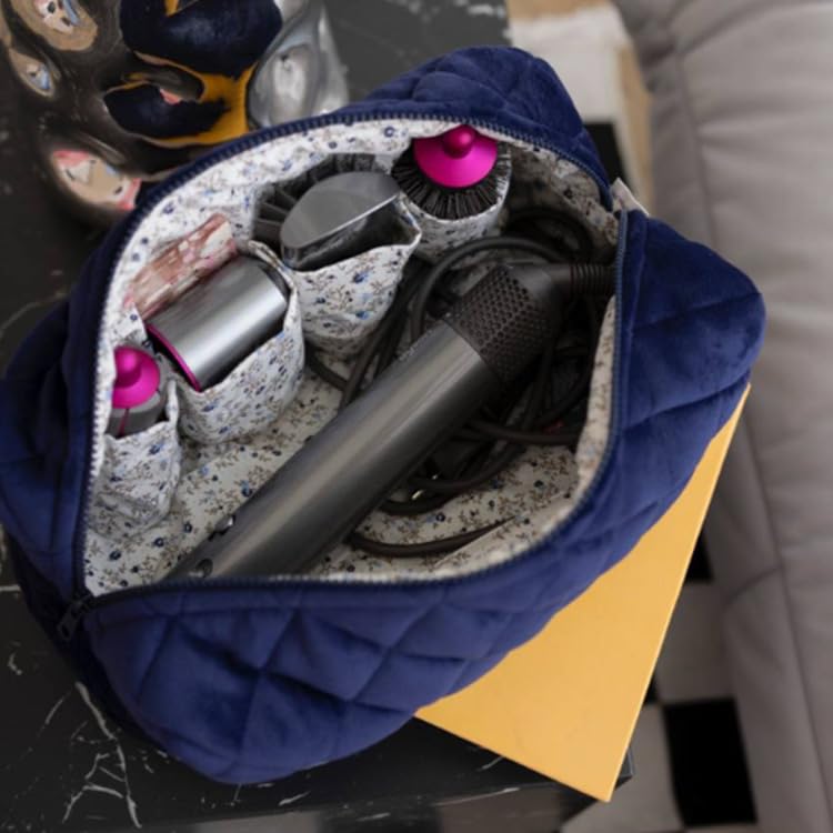Ankick portable styling tool organizer being packed into a standard suitcase showing travel portability