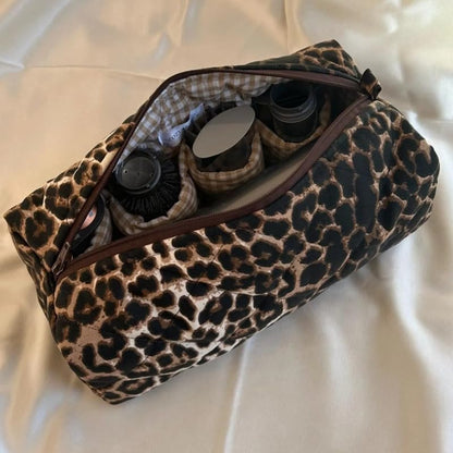 KCWVSIE protective styling tool bag placed next to travel luggage