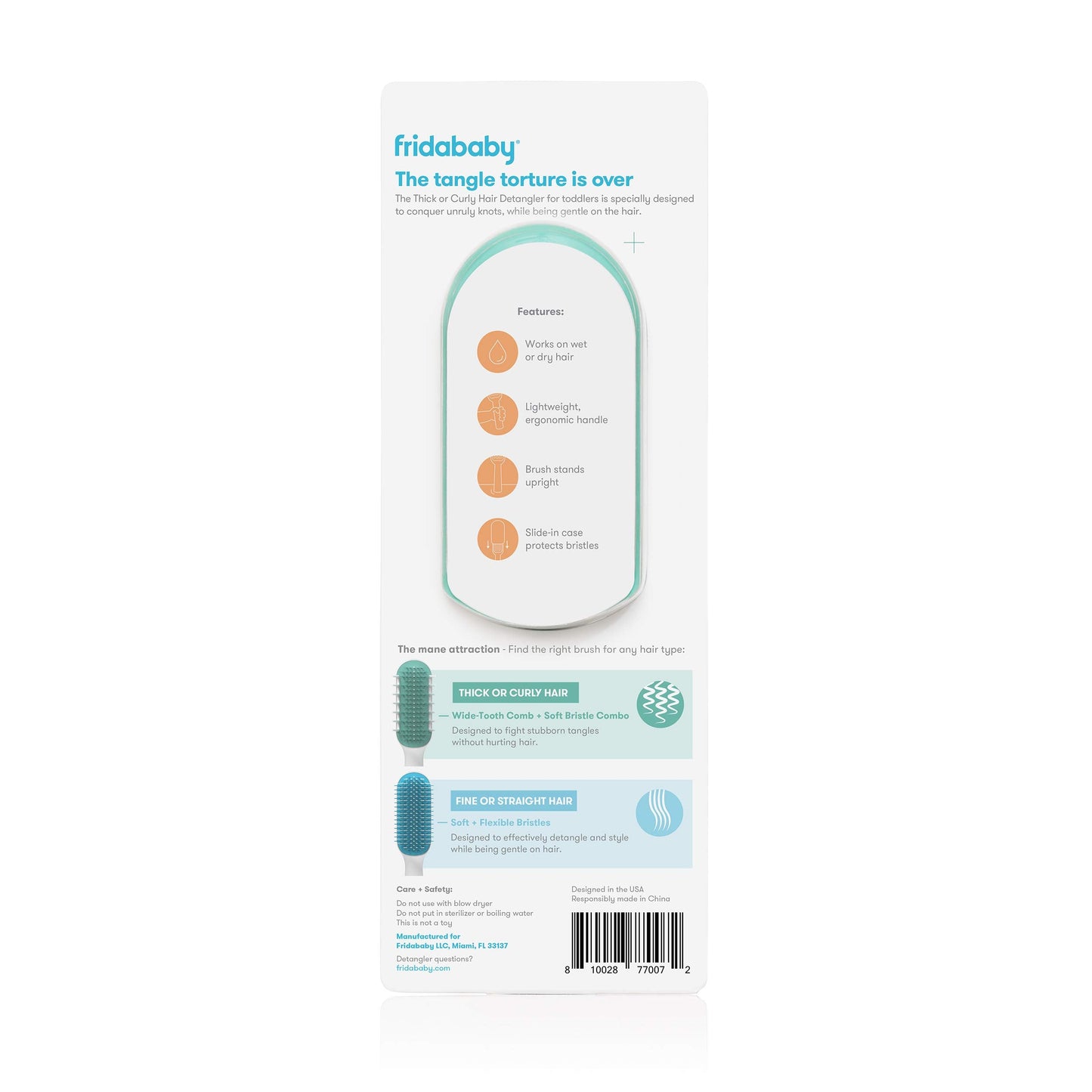Frida Baby detangler brush held in hand showing ergonomic handle