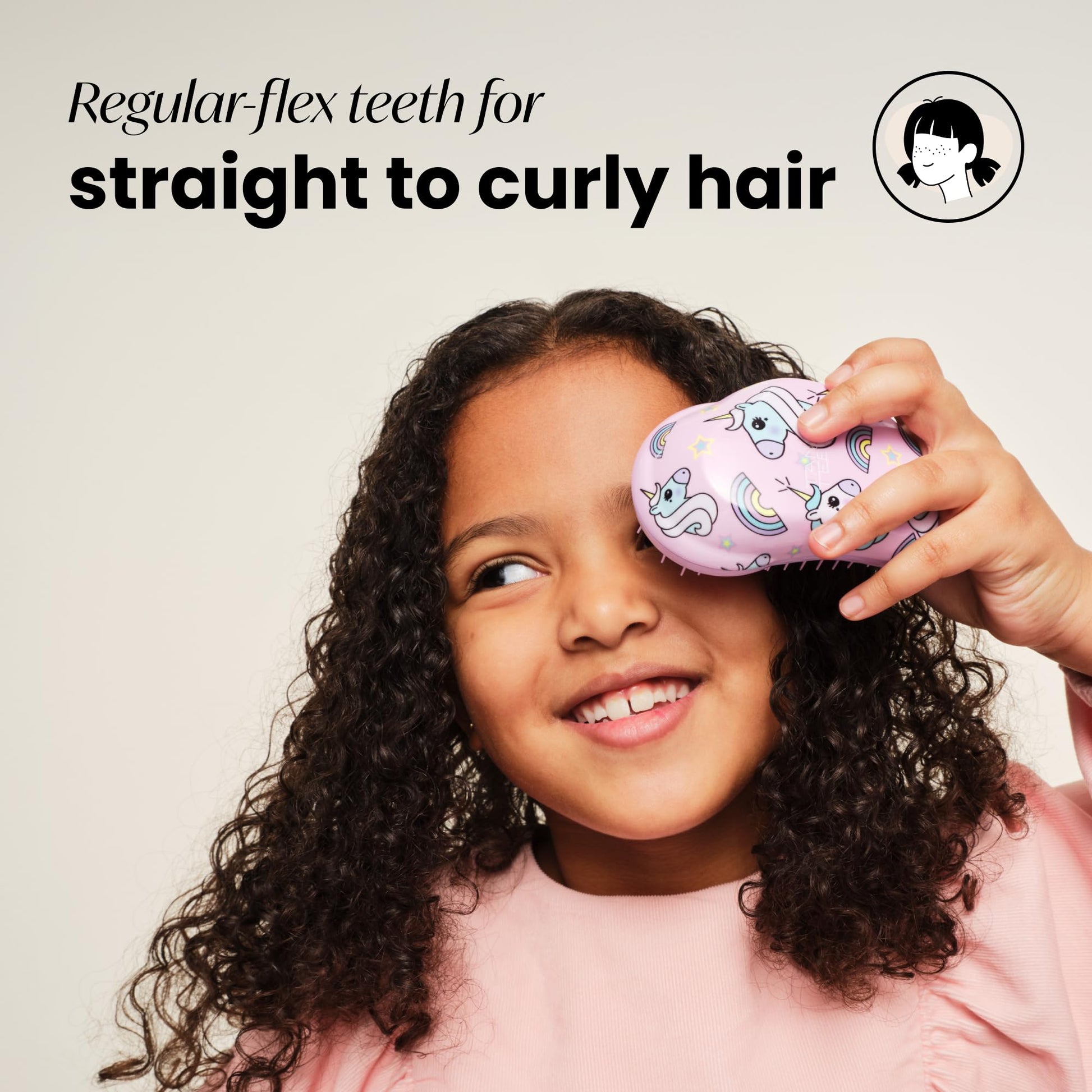 Tangle Teezer compact brush held in hand for size reference