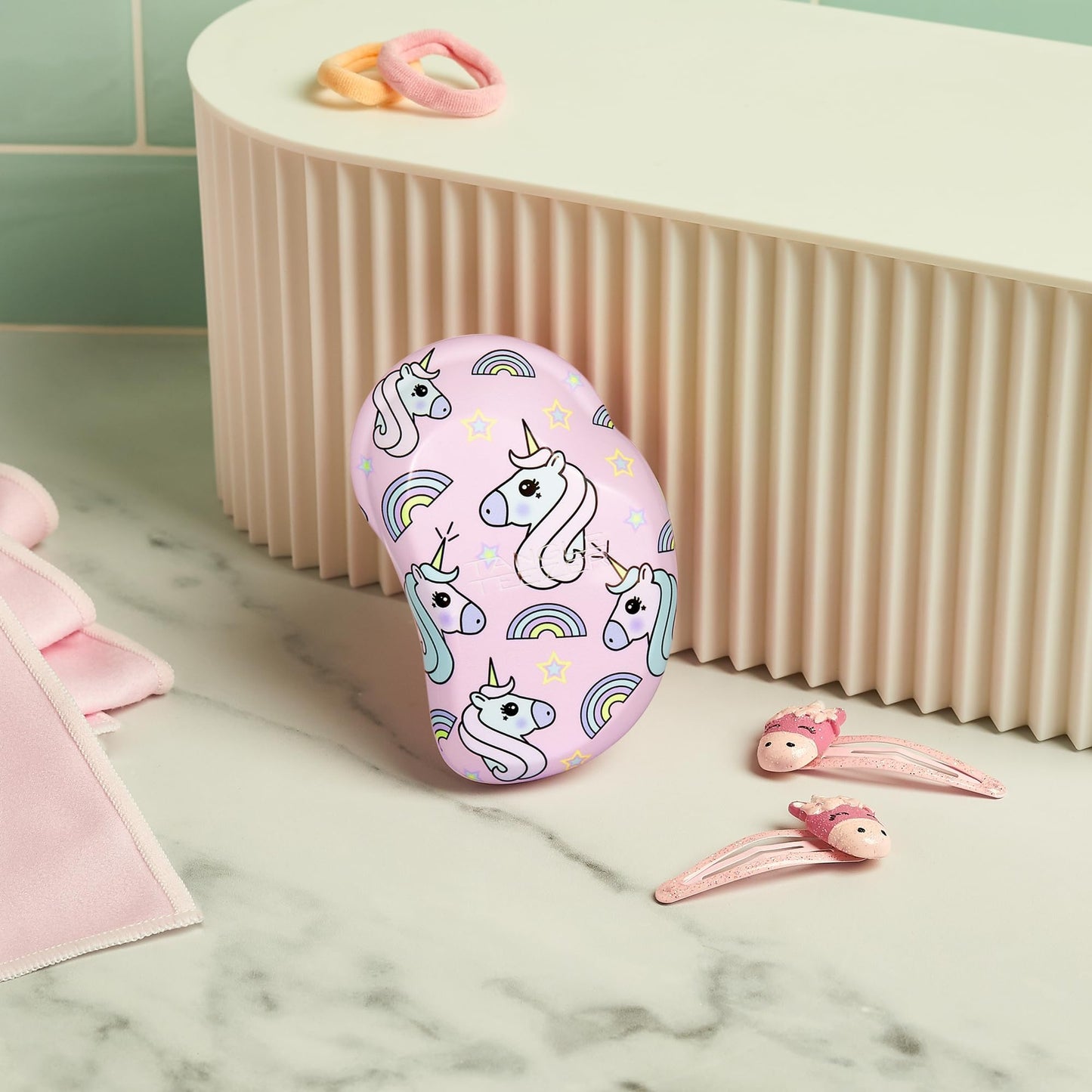 Tangle Teezer mini hairbrush on a vanity
