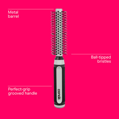 Ergonomic soft-ridged rubber handle of the Conair professional styling brush for firm grip control.