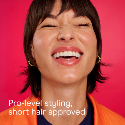 Conair hair brush for blowout sessions being held to demonstrate the comfortable non-slip design.