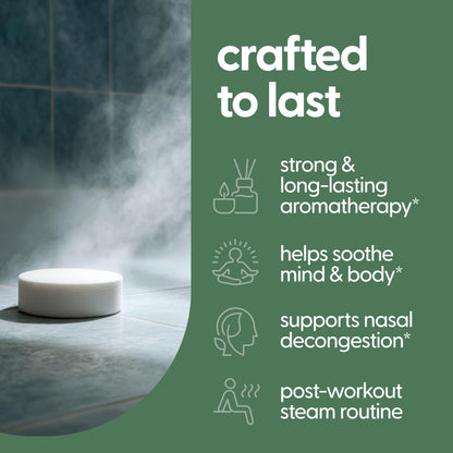 A continuous stream of warm water activating a wellness shower tablet on the floor to release aromatic vapors.