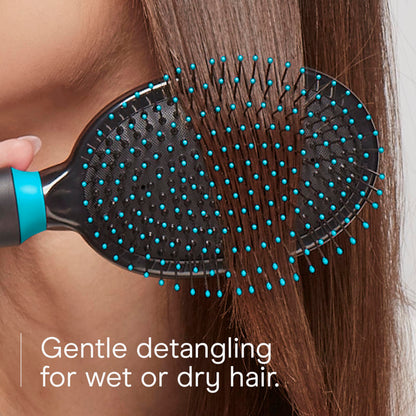 Conair metal bristle hair brush showing the ergonomic grooved non slip handle design