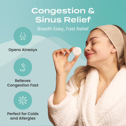 Body Restore essential oil tablets dissolving on a shower floor to release soothing aromatic herbal steam.
