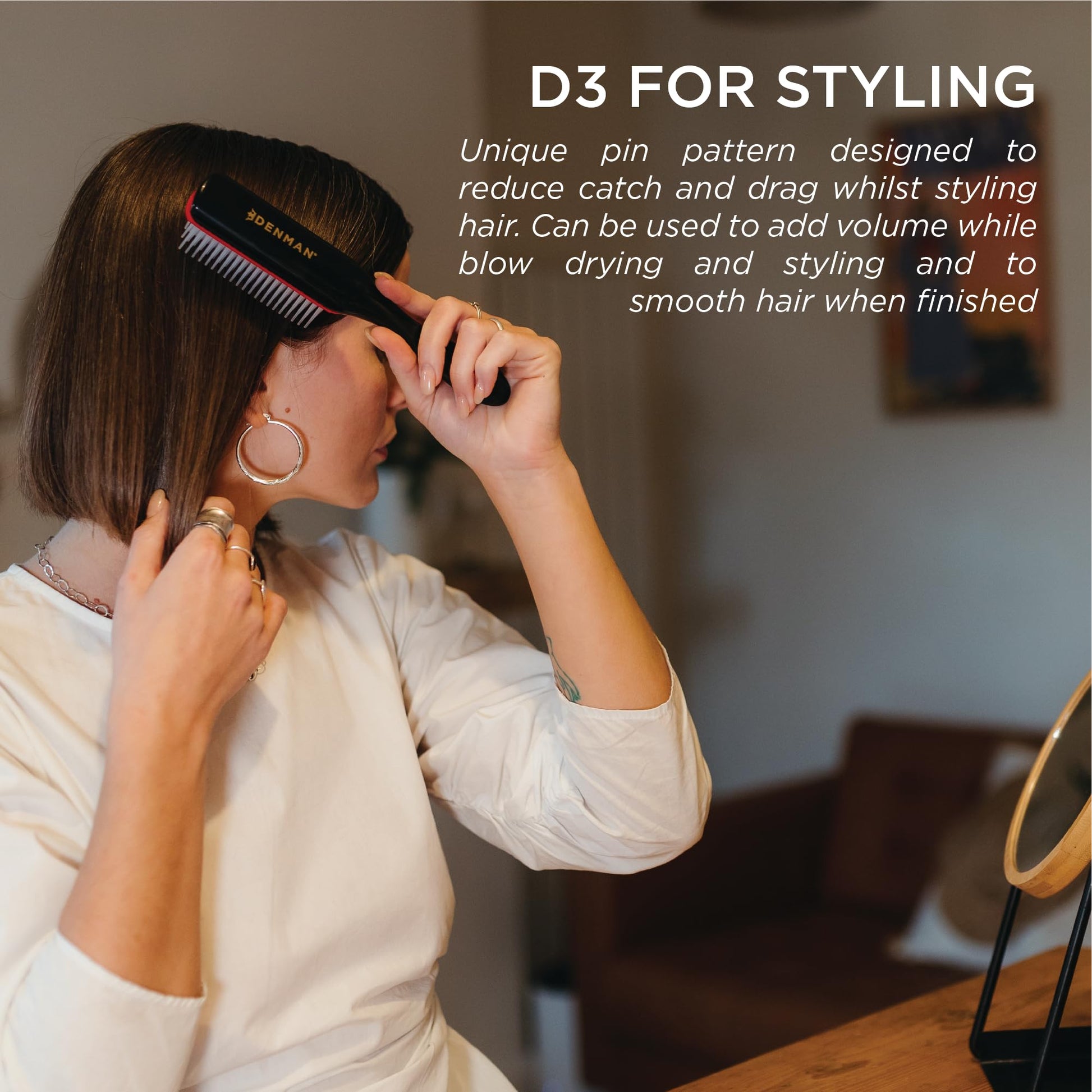 Ergonomic teardrop handle design of the authentic Denman styling hair brush