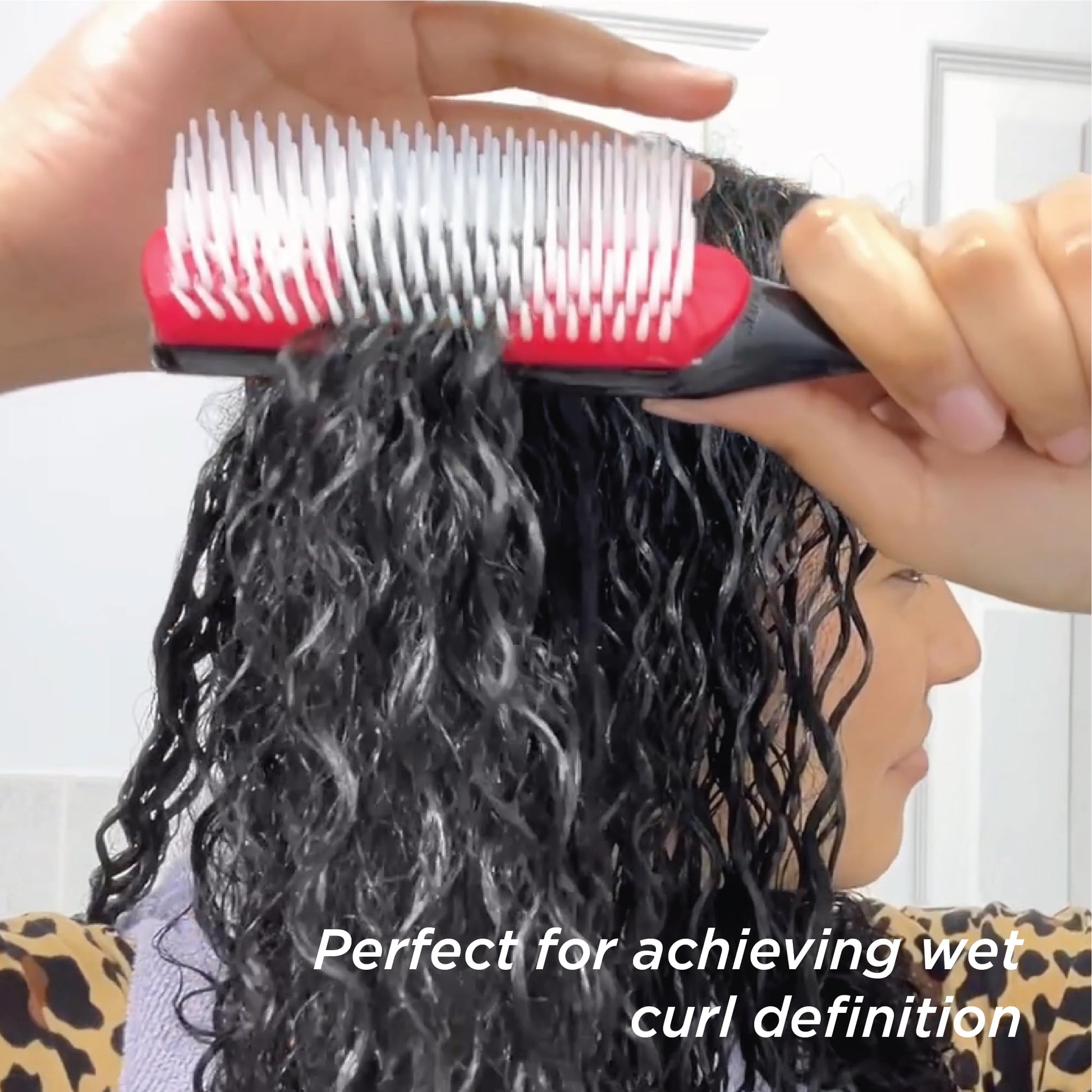 Denman curly hair brush packaging highlighting the official brand logo