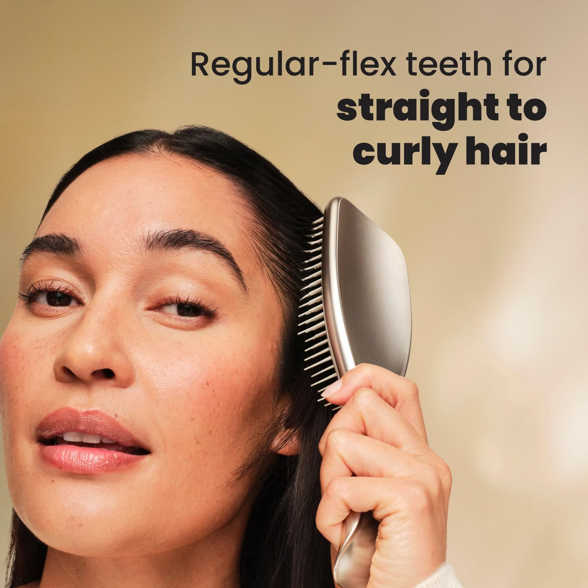 Tangle Teezer brush held in hand to show size and grip