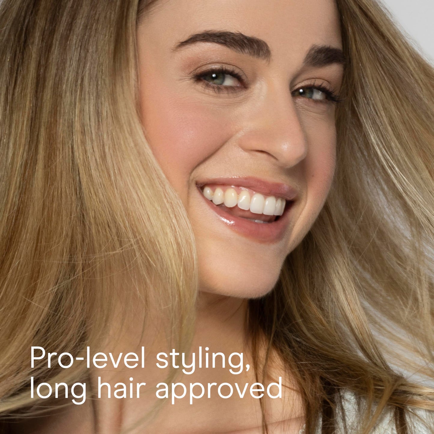 Top view of the round volumizing hairbrush showcasing the dense pattern of the flexible nylon bristles.
