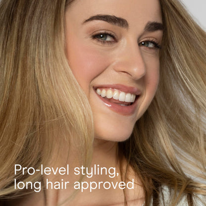 Top view of the round volumizing hairbrush showcasing the dense pattern of the flexible nylon bristles.