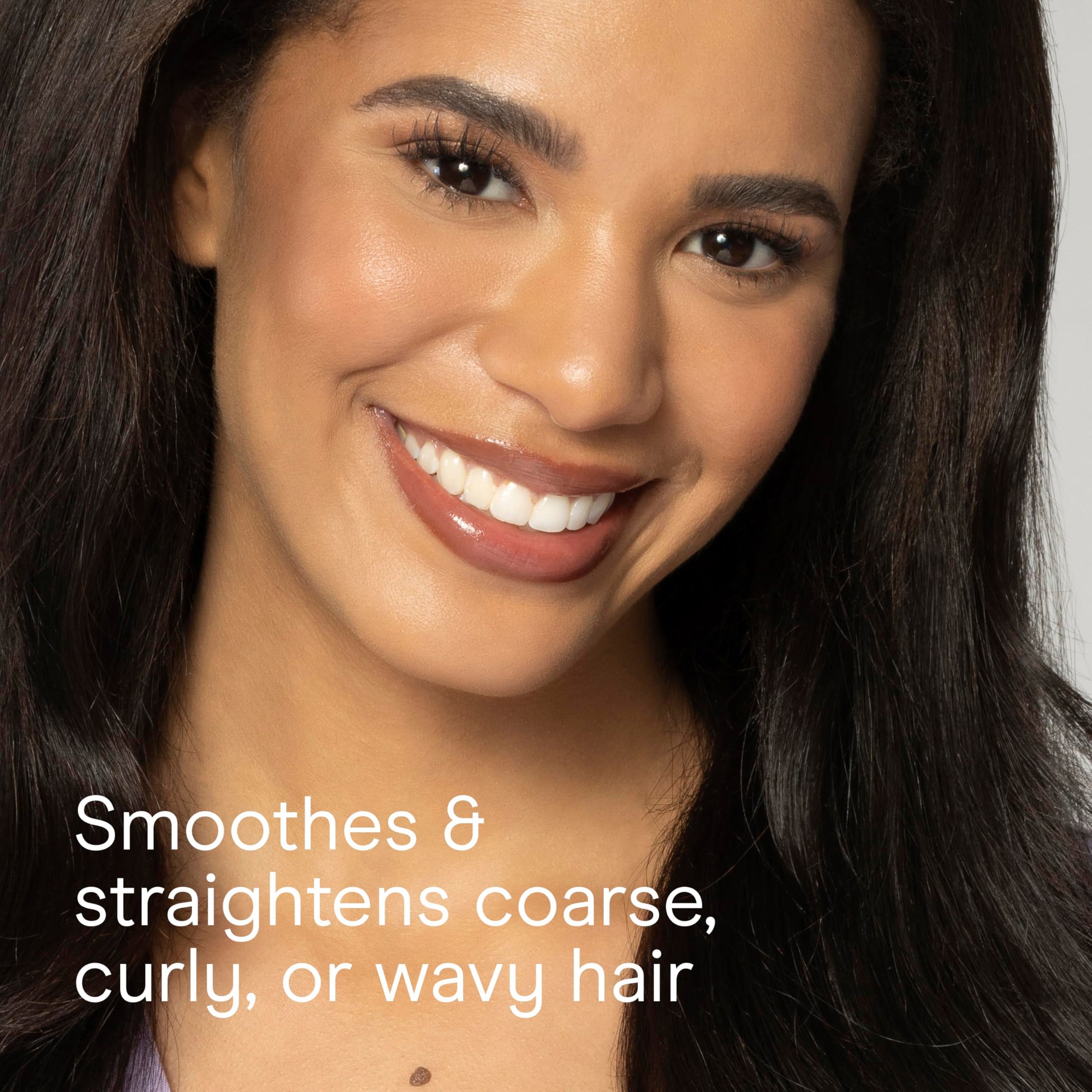 Full length view of the Conair blowout brush highlighting the sleek black and teal design components.