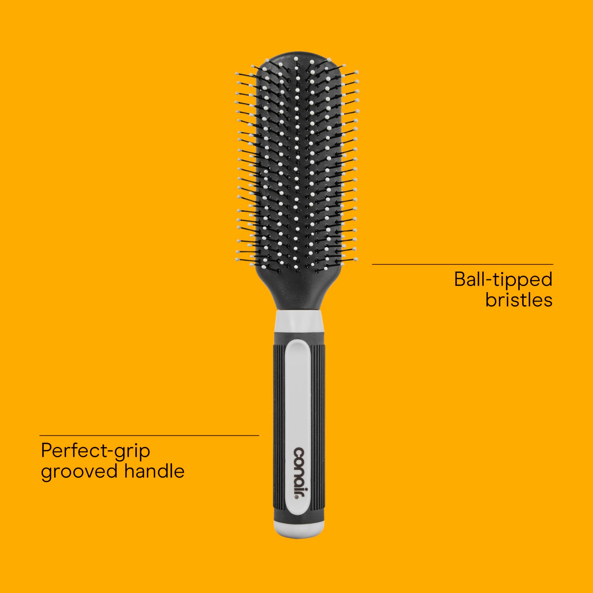 Close-up perspective of the flexible protective cushion base on the imported Conair professional grooming brush.