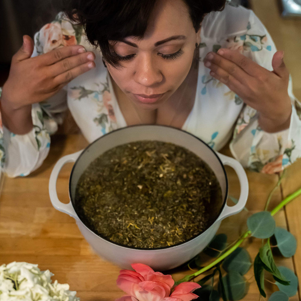 Wildflower Wellness botanical steam preparation in a glass bowl