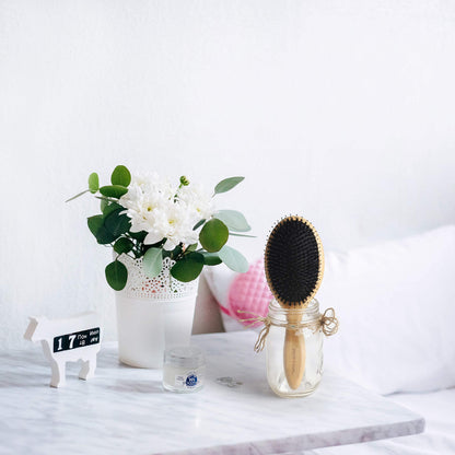 BESTOOL bamboo paddle brush back view displaying the smooth natural wood grain finish and authentic branding.