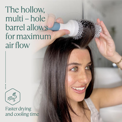 Professional blow drying brush by Osensia showing vented barrel design