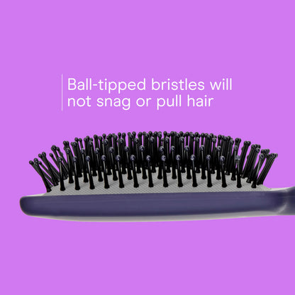 Conair cushion brush for men and women showing the flexible black styling pad.