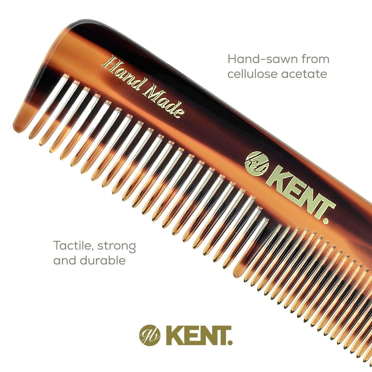 Compact eleven centimeter Kent tortoiseshell pocket comb held in hand for scale