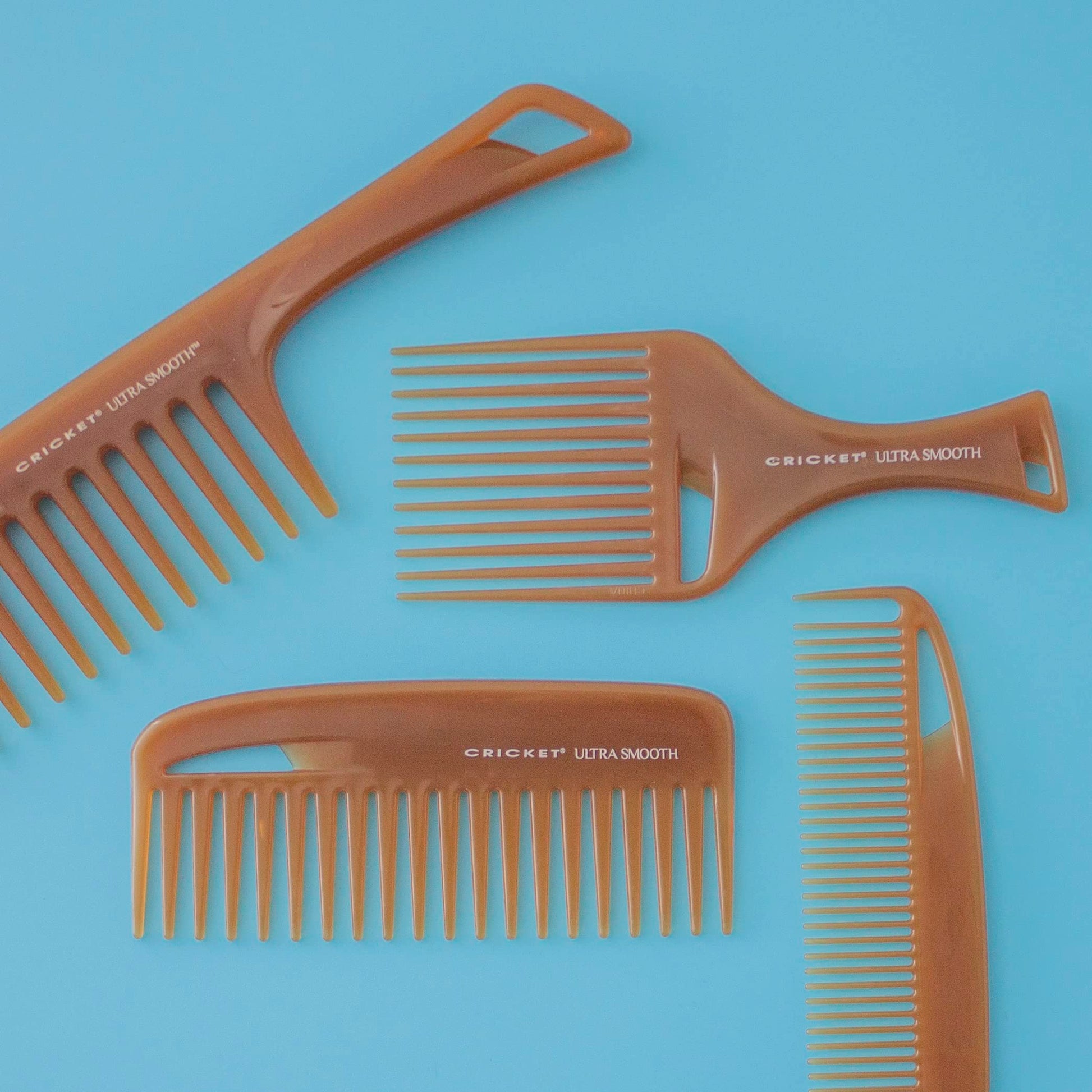 Cricket wide tooth detangling comb demonstrating its smooth finish and texture.