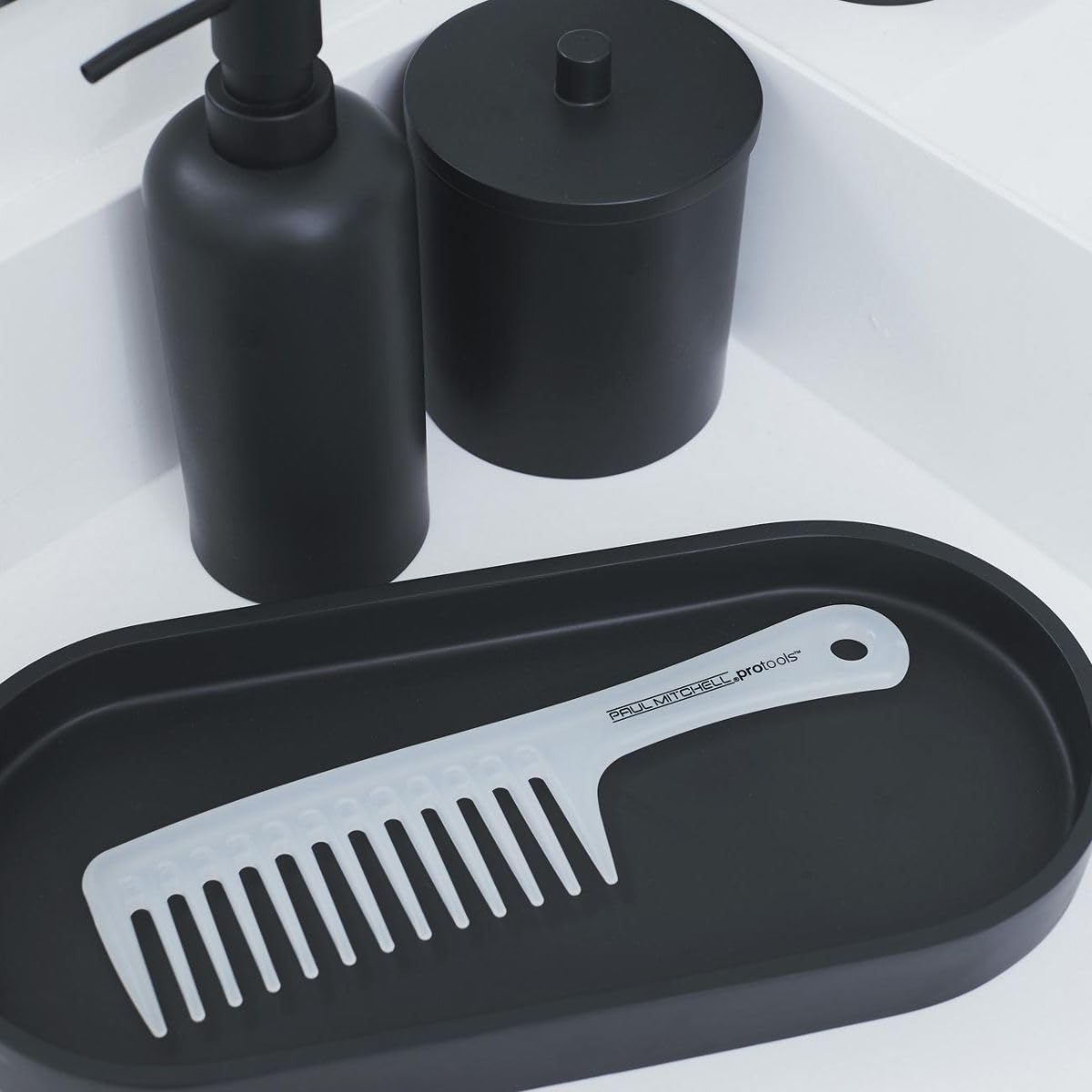 Paul Mitchell unisex detangling tool for safe dry hair combing and damage control.