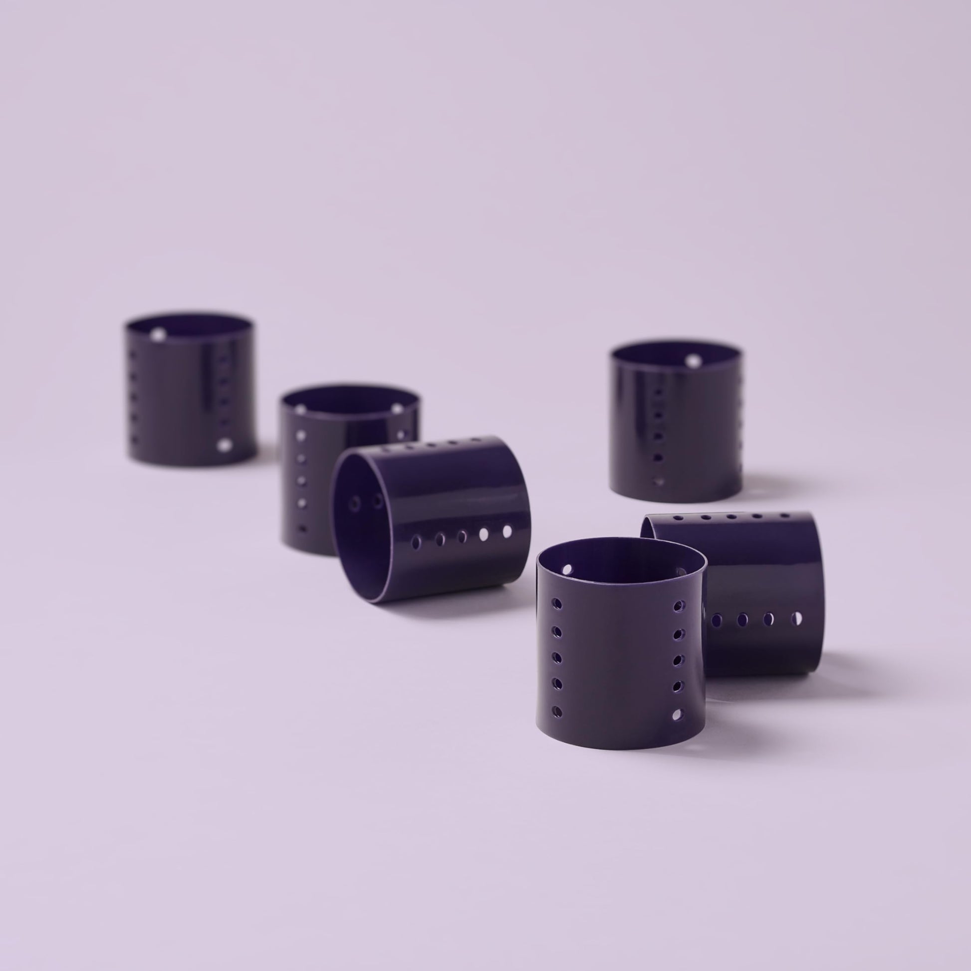 Close up of Diane jumbo purple hair rollers highlighting the ventilated airflow holes.