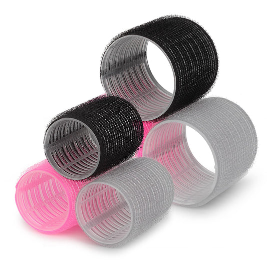 Pink hair rollers with duckbill clips and sectioning rat tail comb for heat free styling