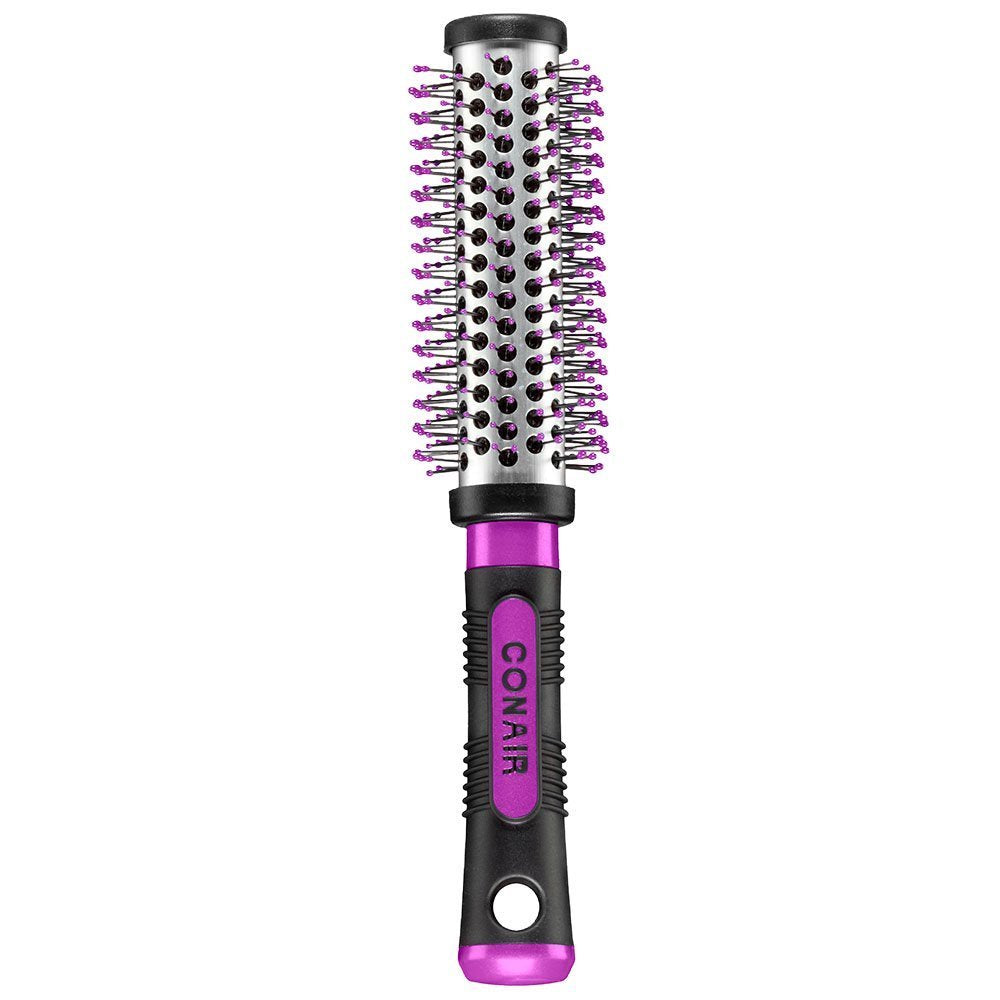 Conair blowout dryer brush being held to highlight its lightweight ergonomic handle structure.