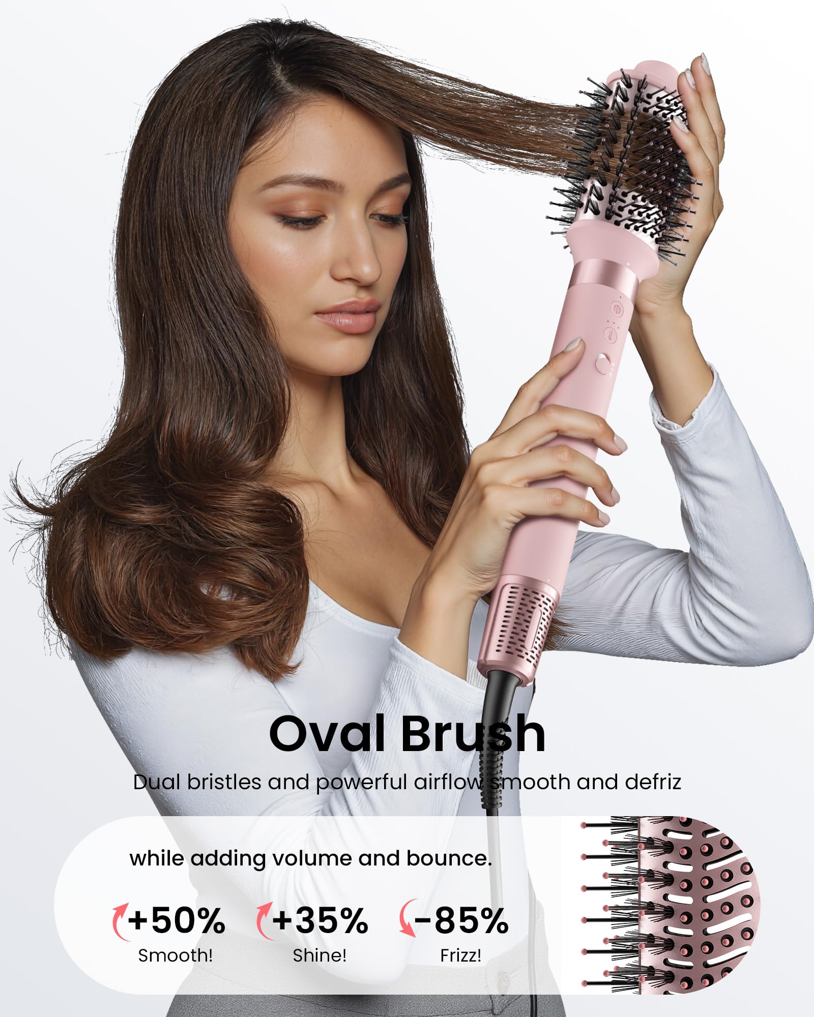 Oval volumizing brush attachment on the premium pink ionic hair styling tool