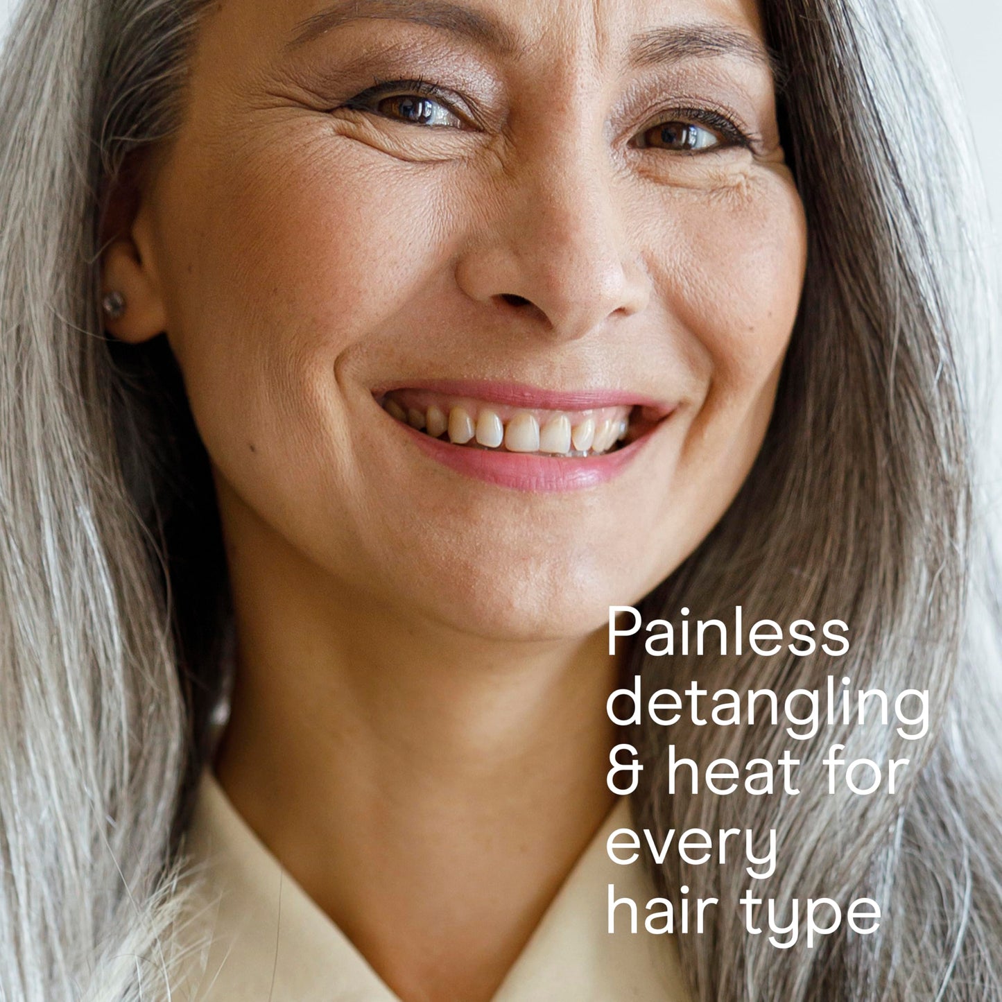 A detailed view of the cool shot button and temperature control dial on the Conair professional styling tool.