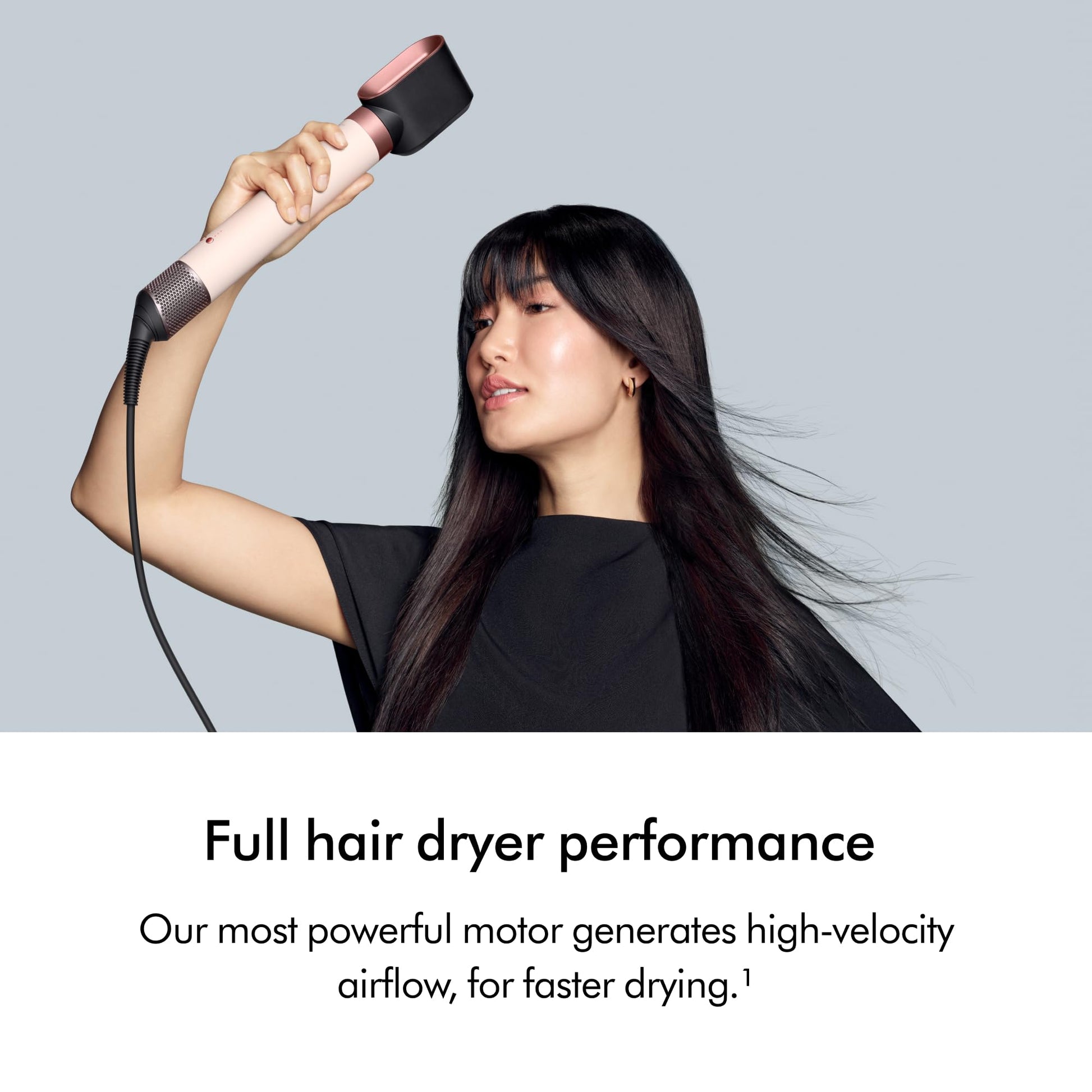 Smoothing brush attachment being applied to wavy hair to show frizz reduction