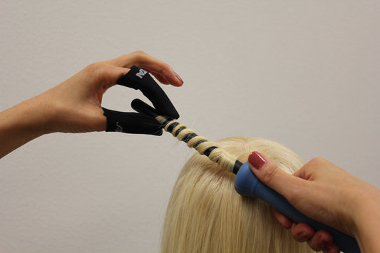 Black heat resistant finger guards for hair styling irons close up view