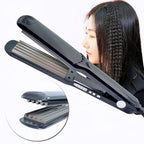 Side profile of the Wangmeili small wave curling flat iron showcasing the corrugated plates design.