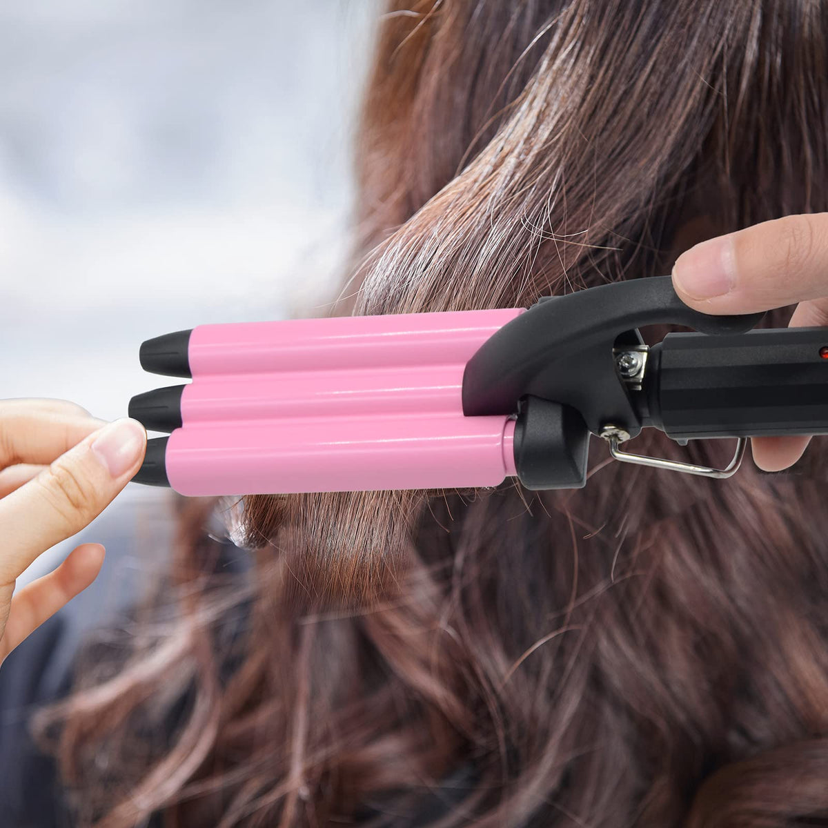 Jane Love triple barrel hair waver highlighting the simple power switch and indicators.