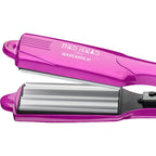 Close up view of the 2 inch tourmaline ceramic rippled plates on the Bed Head Waveaholic tool